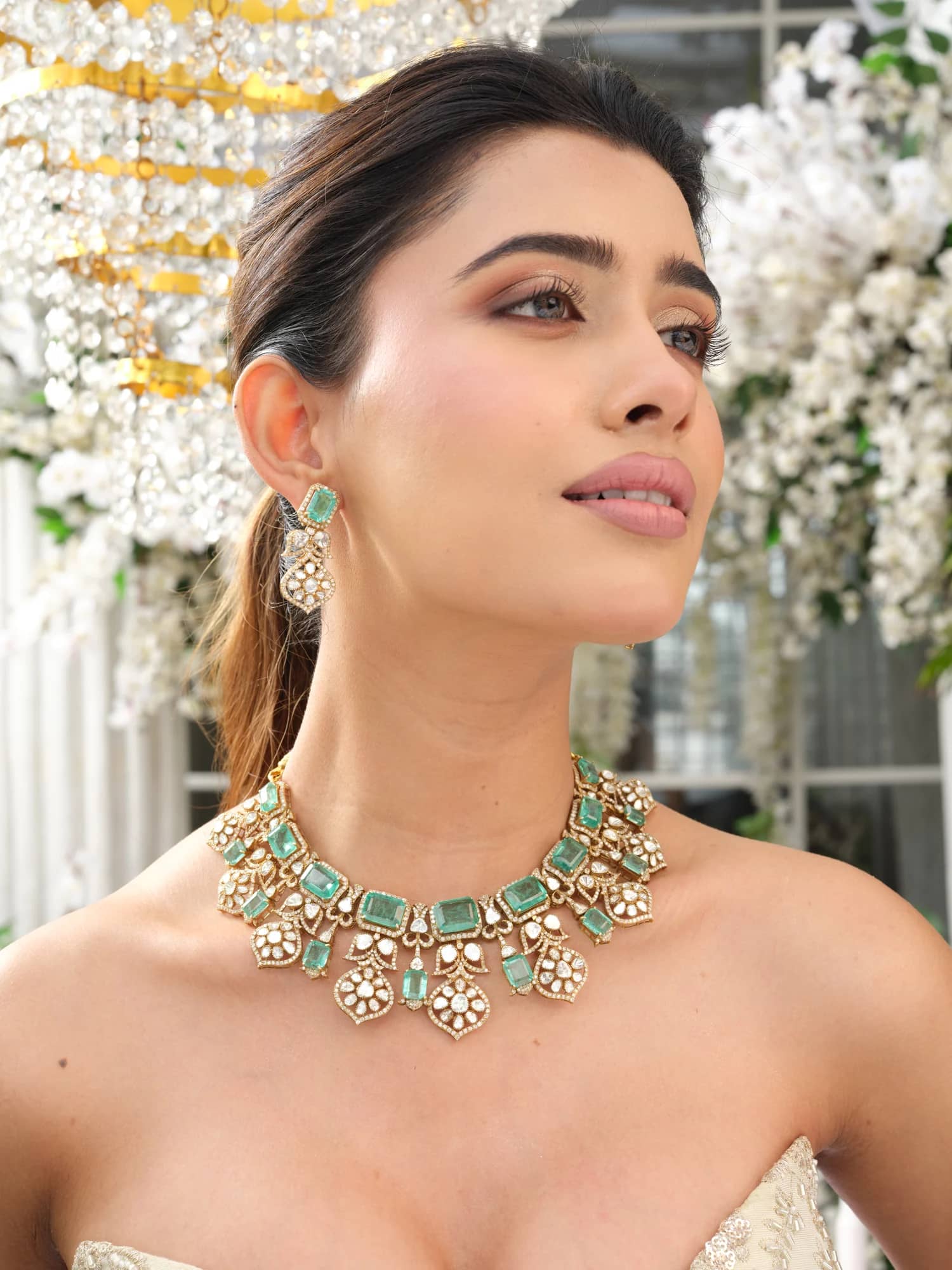 The finished emerald and polki collar, worn